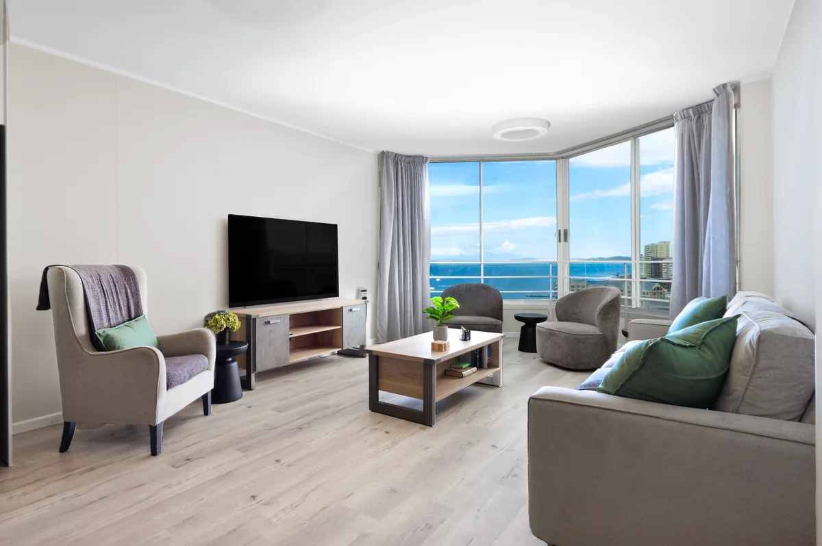 Bright living room with panoramic False Bay views in Seaside Sanctuary apartment 1102