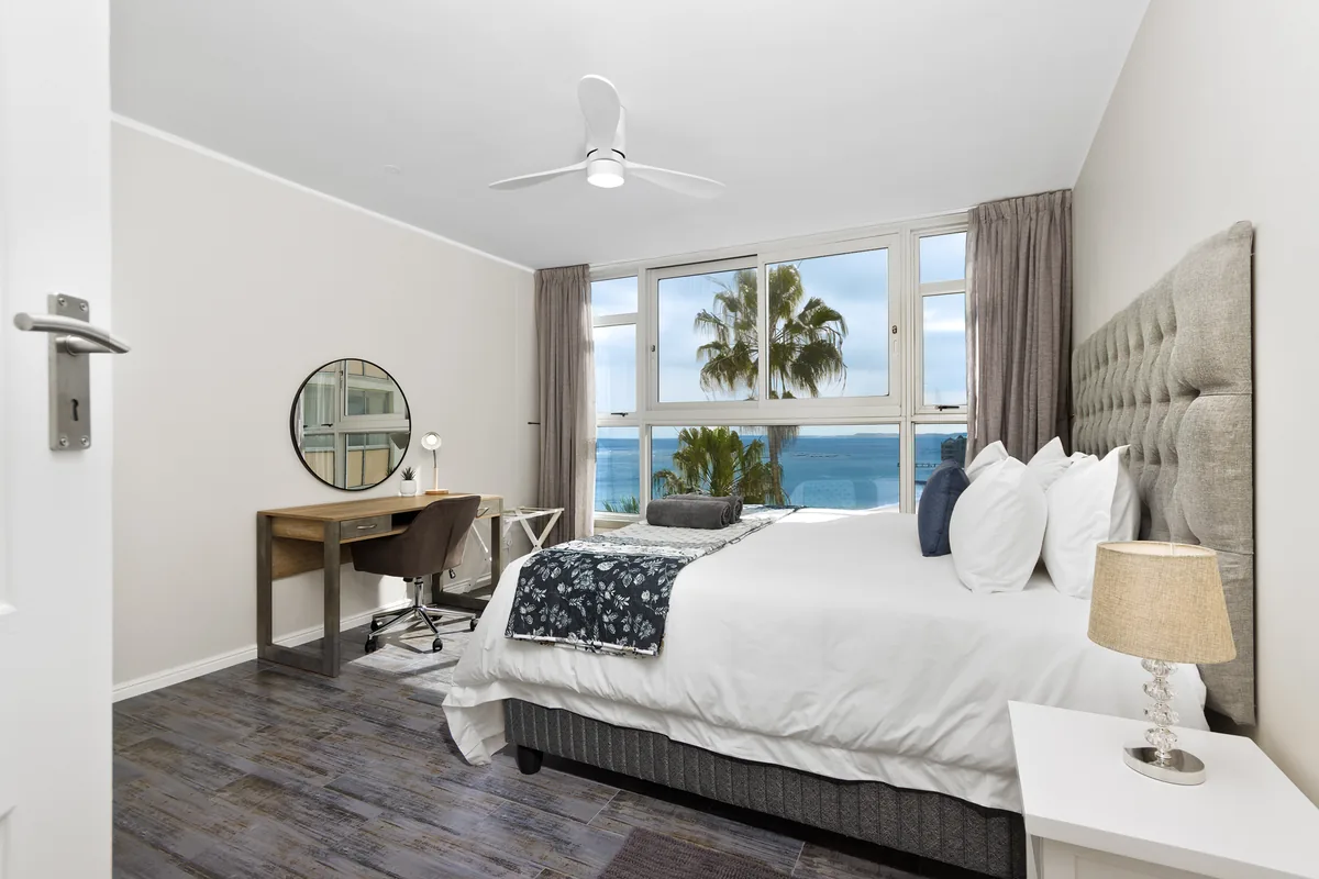 Main bedroom with a desk and a view towards Strand Beach